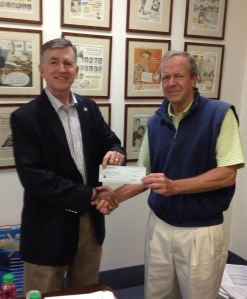 Grins President, Ed Battle (right) presents a check to Patriot Foundation President Chuck Deleot (left). Grins proudly donates 3% of gross revenues (uncapped) to the Patriot Foundation.